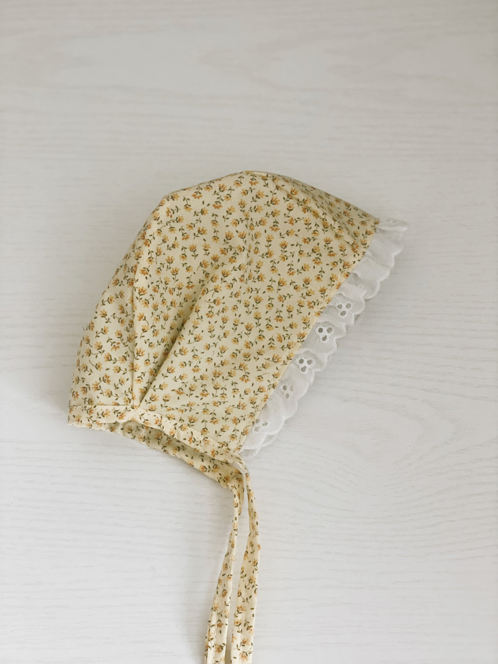 Yellow floral eyelet bonnet