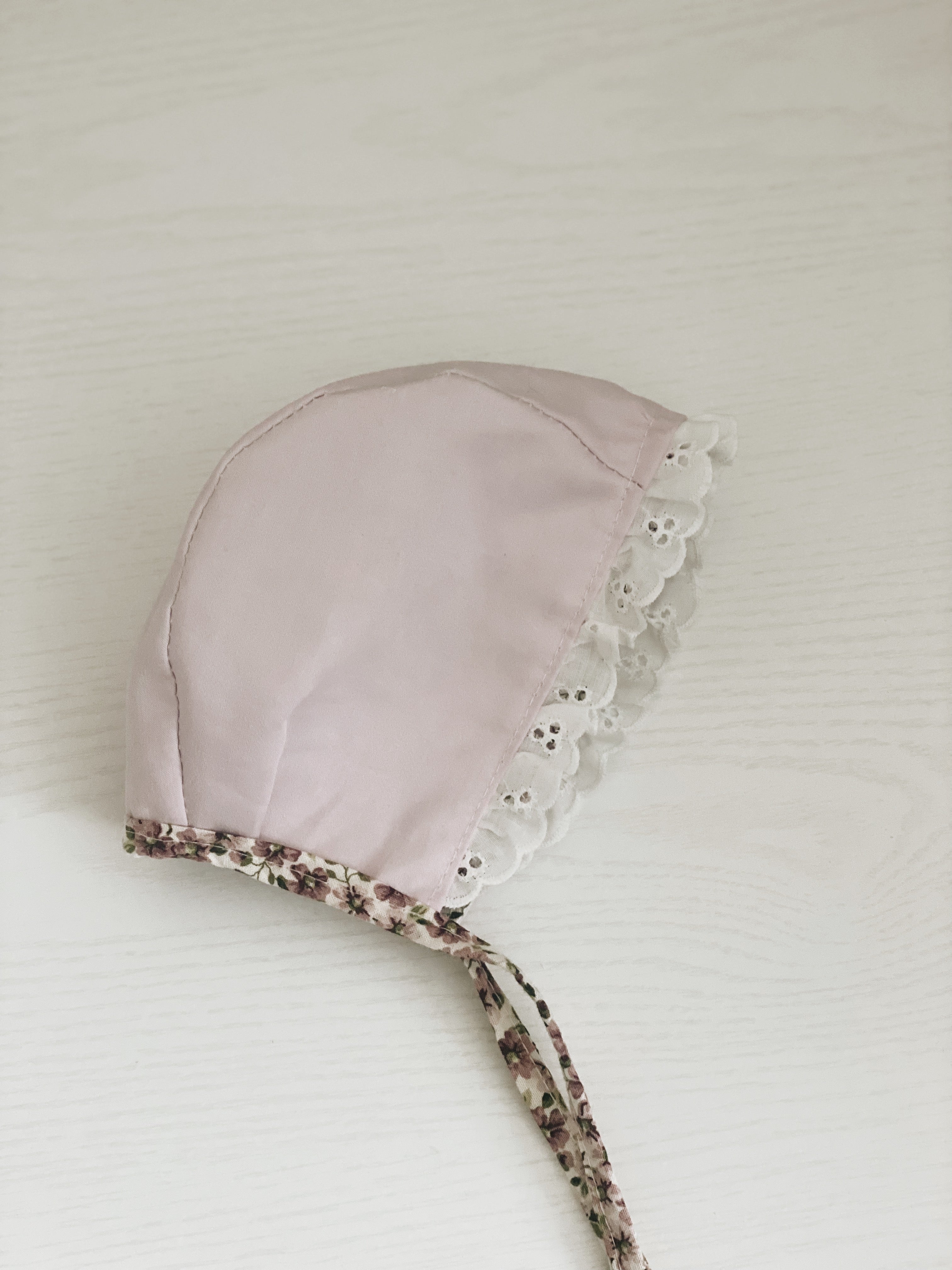 Purple floral eyelet bonnet